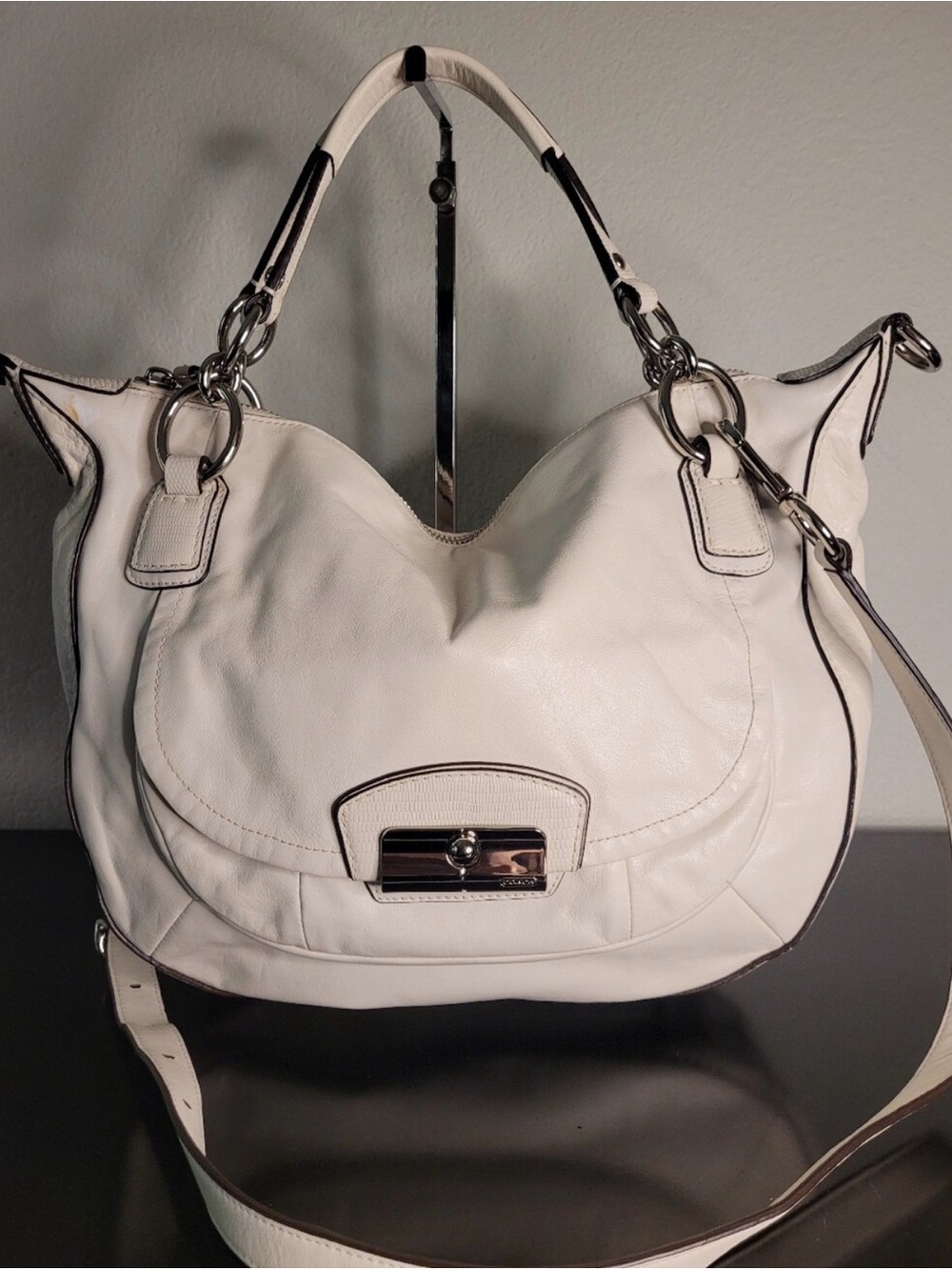Coach Kristin hobo bag features white leather with silver-tone hardware